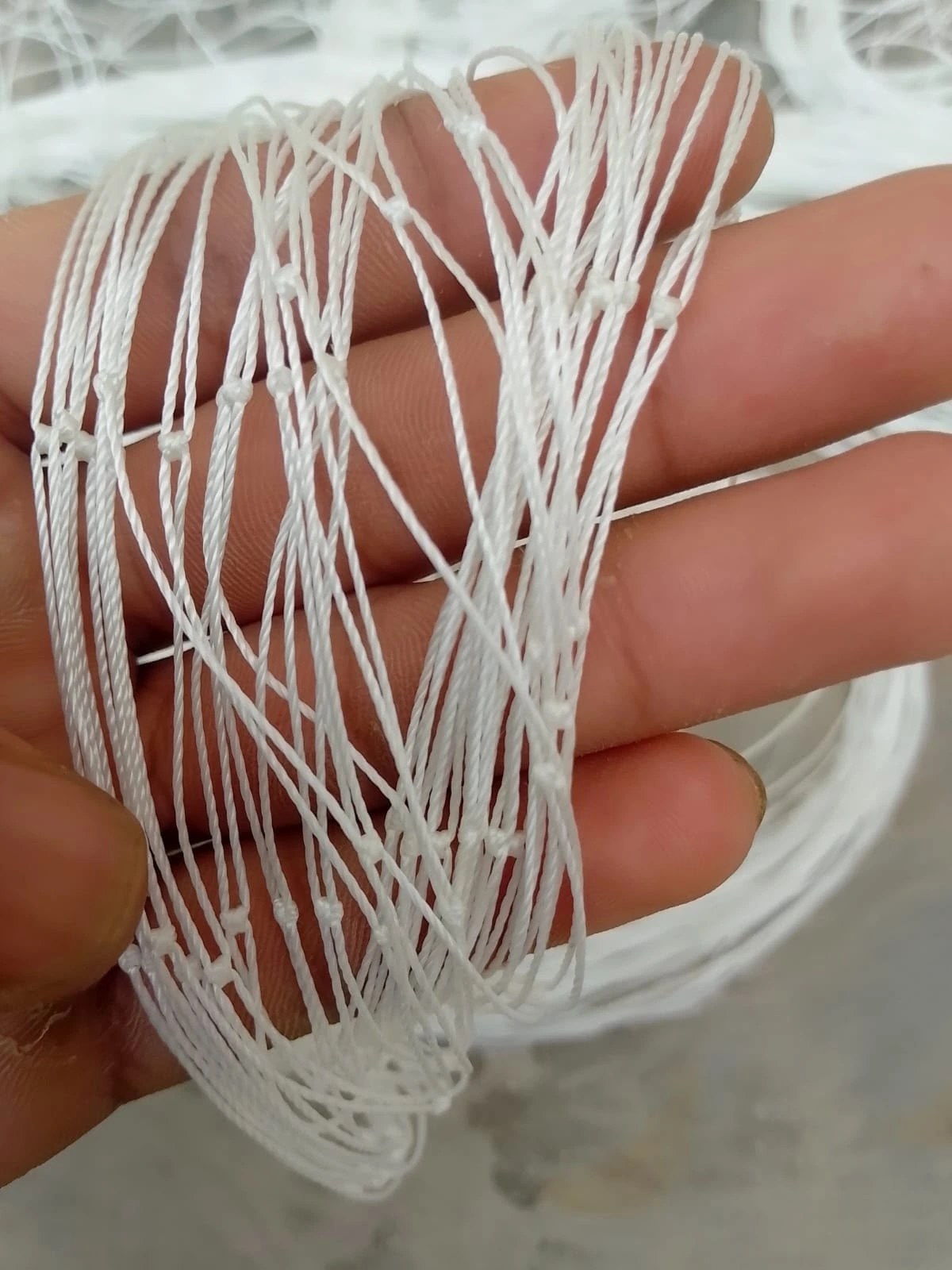 Close-up of white knotted cricket net twine by KHS Sports Nets