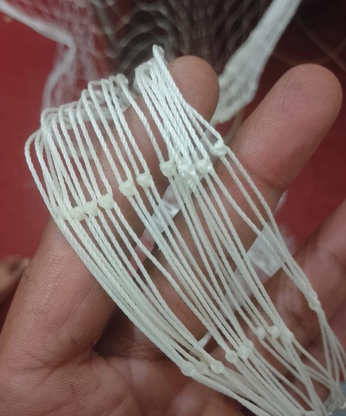 Knotted indoor cricket net mesh showing the tied crossings